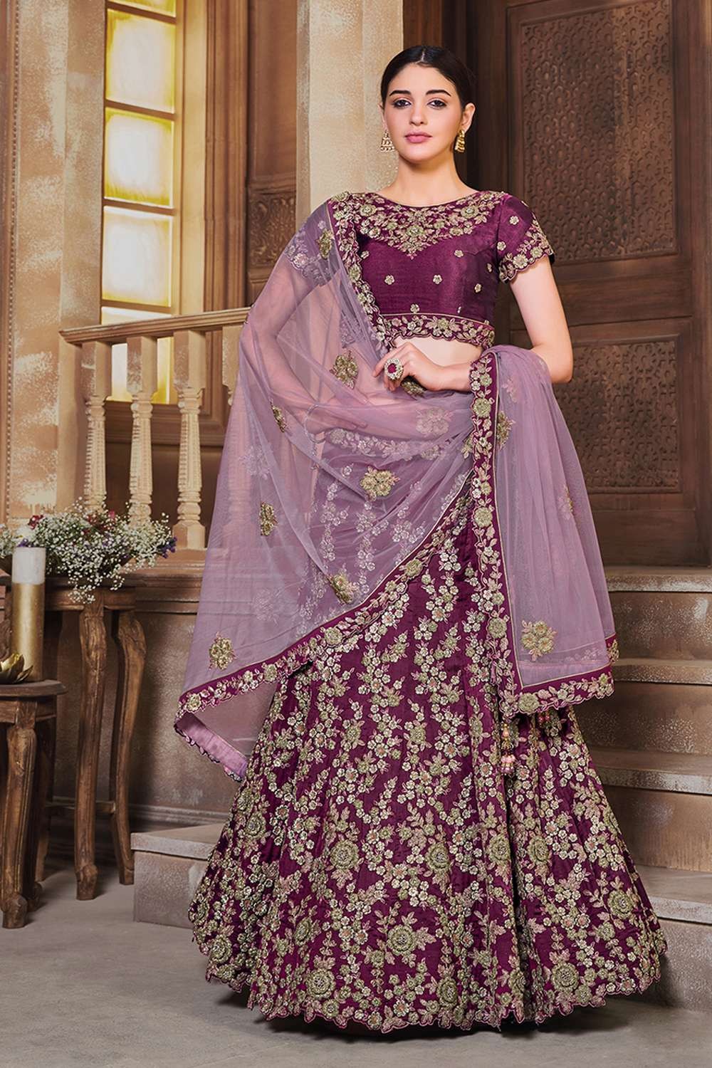 BROWN WINE CUTWORK EMBROIDERED LEHENGA WITH A CONTRAST BISCUIT COLOURED  EMBROIDERED BLOUSE PAIRED WITH A MATCHING DUPATTA AND TASSELS. - Seasons  India