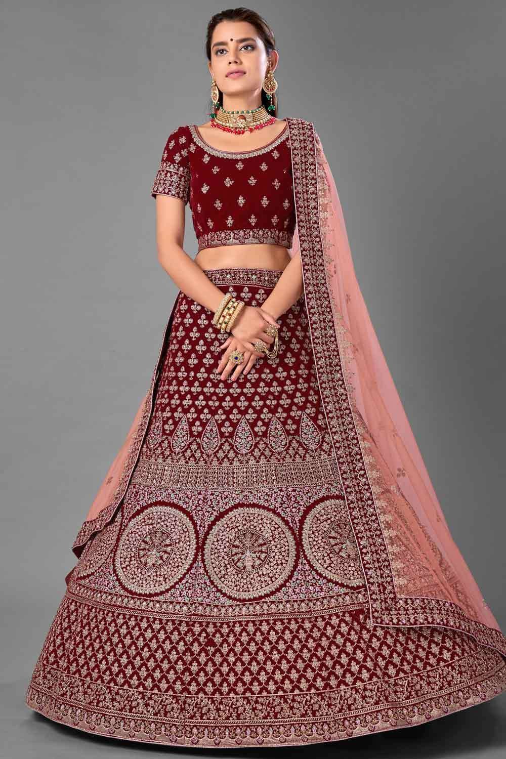 Dark maroon lehenga set features an intricately embroidered imperial motif  skirt & top, contrast embroidery dupatta