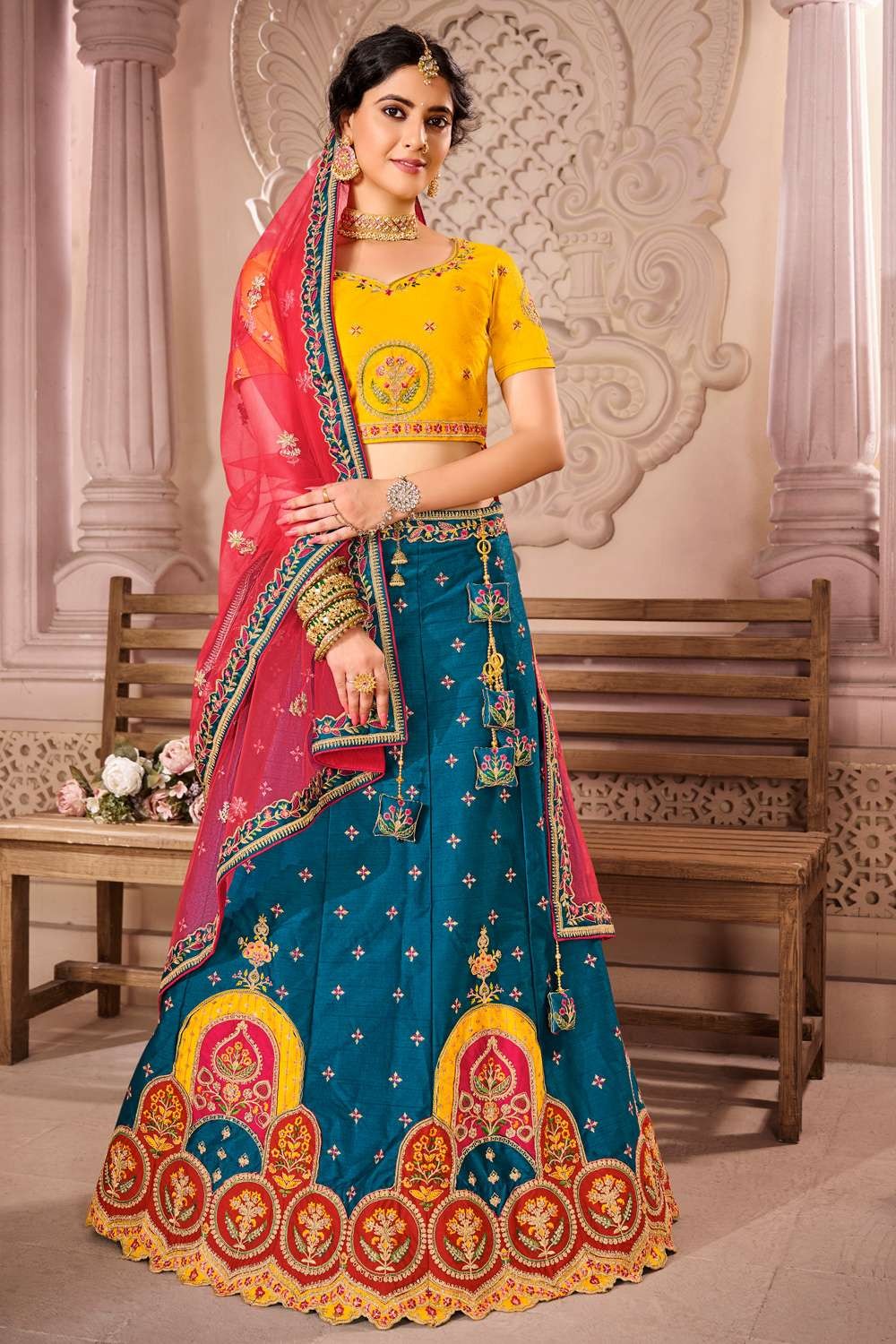 Embroidery Machine Orange Embroidered Net Lehenga at Rs 4999 in Surat