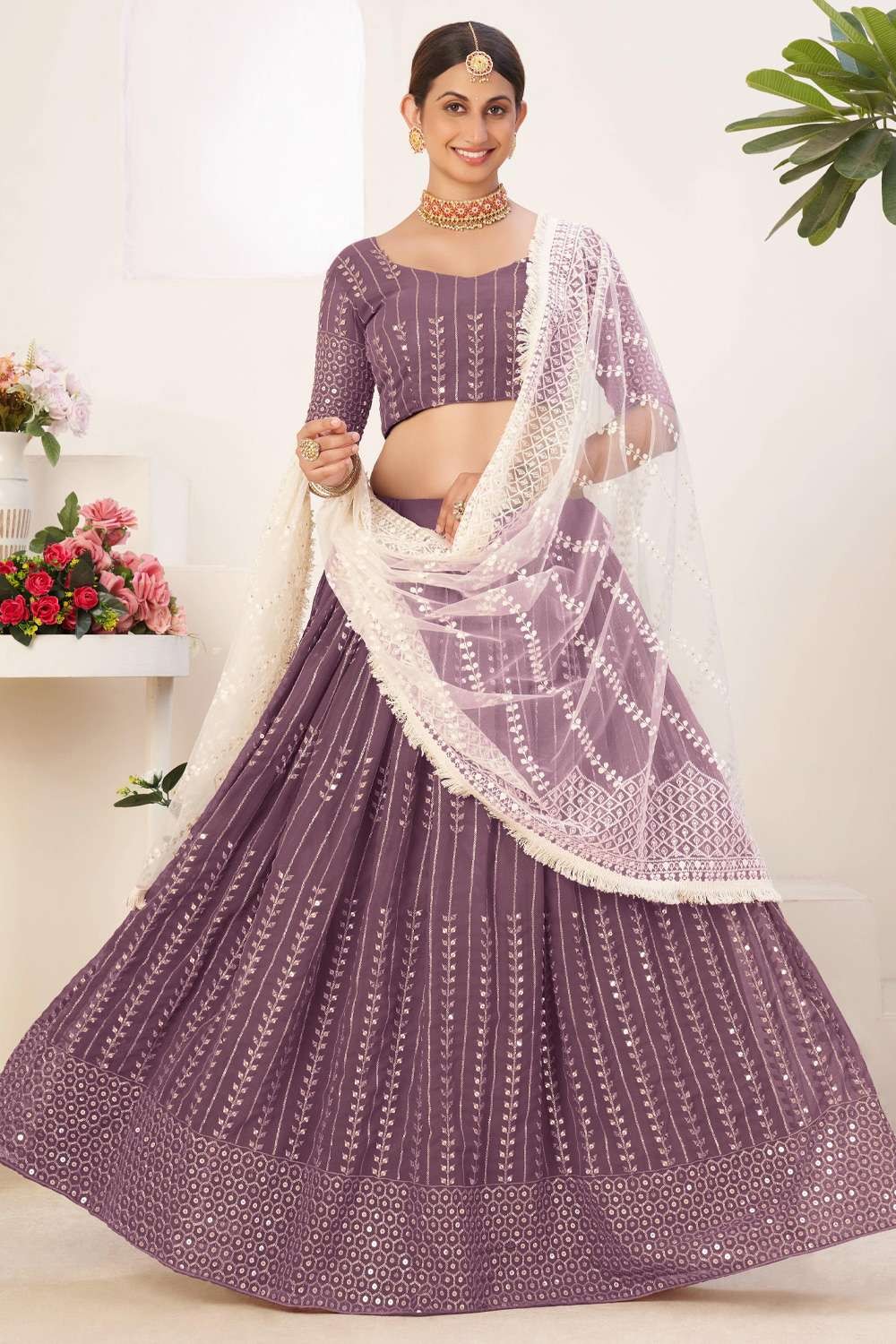 Traditional Silk Fabric Lehenga Choli With Decent Work And Net Dupatta